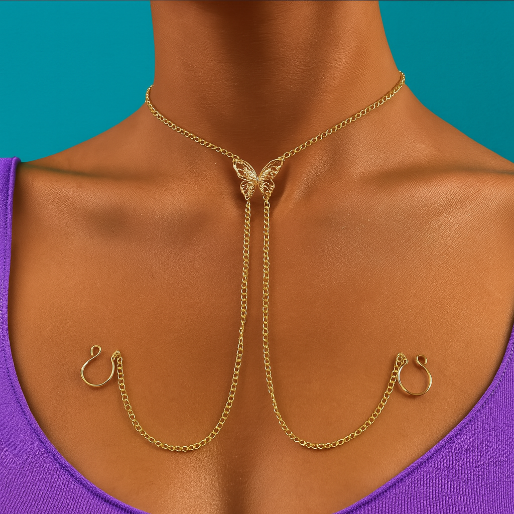 Gold body chain worn by a person with a blue background “Elegant gold body chain featuring a butterfly charm centerpiece, styled over a purple top with a teal background”
