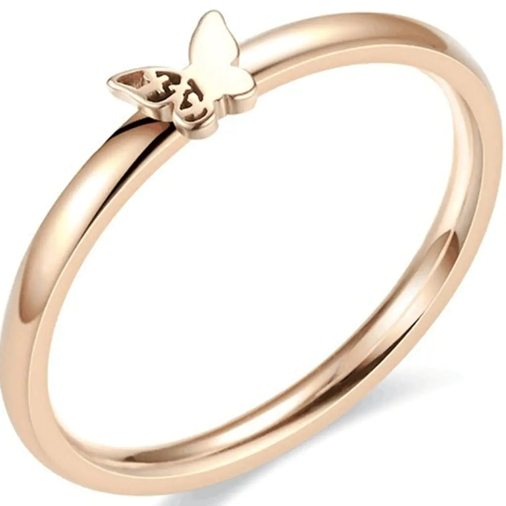 Rose gold ring with a butterfly design on a white background “Simple rose gold ring with a delicate butterfly design on a white background”
